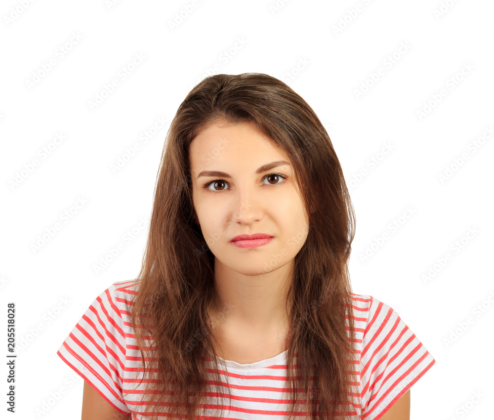 Young serious angry woman in shirt portrait. emotional girl isolated on white background Young serious angry woman in shirt portrait. emotional girl isolated on white background