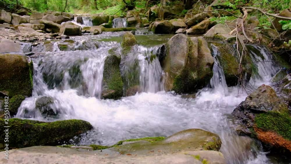 A cascade on the mountain stream A cascade on the mountain stream