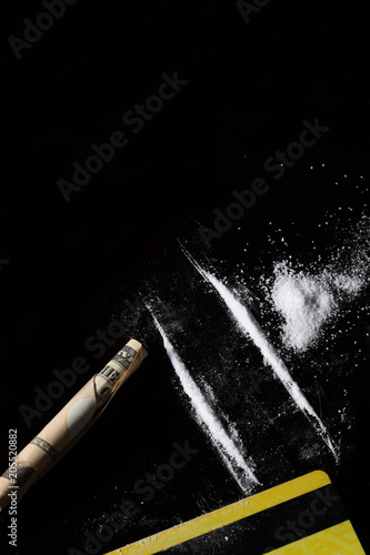 set of cocaine on black background