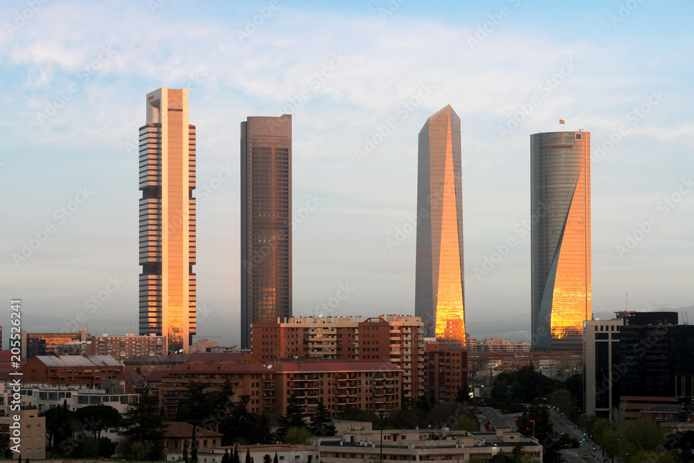 Madrid Four Towers financial district skyline during sunrise in Madrid, Spain.