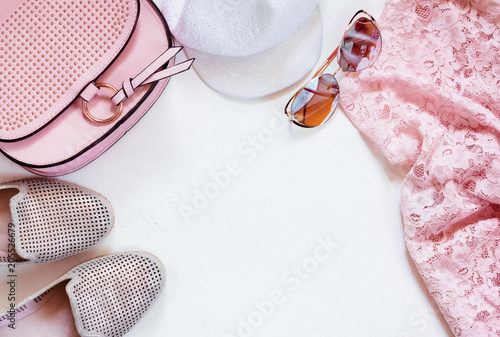 Ladies Fashion Accessories. Pink Clutch, sunglasses, cap, moccasins, blouse. Pastel colors Trend, copyspase