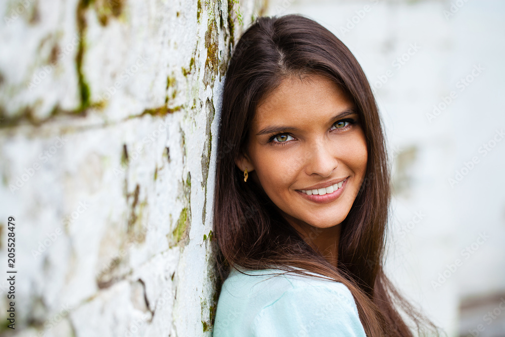 Portrait of beautiful young happy woman