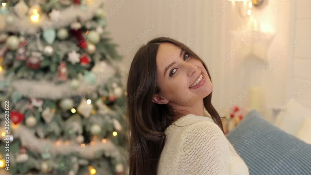 Portrait of a beautiful pregnant girl against the background of the Christmas tree. Portrait of a beautiful pregnant girl against the background of the Christmas tree.