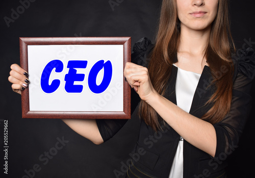 In the hands of a businessman a frame with the inscription:CEO