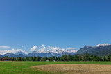View of the green field and mountains of the Alps in Liechtenstein.