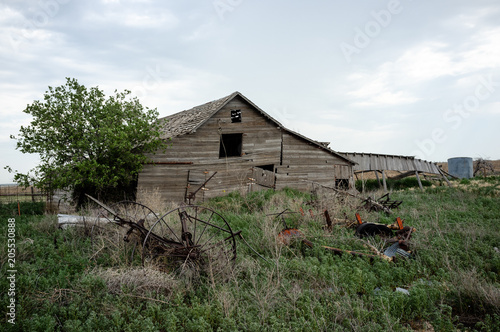 Obraz na plátně Old Barn with farm equipment
