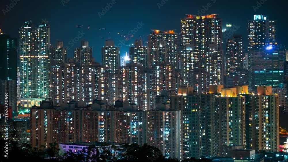 Spectacular cityscape of night Hong Kong with modern tall buildings or skyscrapers with lit windows and glowing illumination. Nightlife of beautiful Asian city or megalopolis. Time lapse video. Spectacular cityscape of night Hong Kong with modern tall buildings or skyscrapers with lit windows and glowing illumination. Nightlife of beautiful Asian city or megalopolis. Time lapse video.