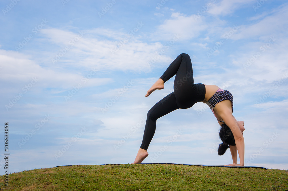 Fototapeta premium yoga girl In the morning time on blue sky background Strengthen the concentration of skin, health and good health is a good exercise