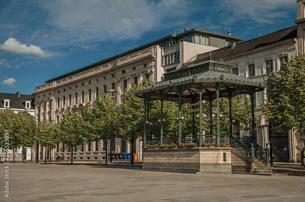 Fototapeta premium Square with gazebo, ancient buildings and sunny blue sky in the City Center of Ghent. In addition to intense cultural life, the city is full of Gothic and Flemish style buildings. Northern Belgium.