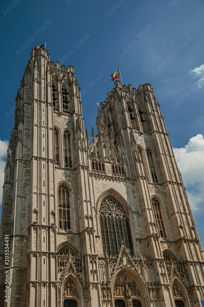 Fototapeta premium Gothic facade of St. Michael and St. Gudula’s Cathedral and blue sunny sky in Brussels. Vibrant and friendly, is the country’s capital and administrative center of the EU. Central Belgium.