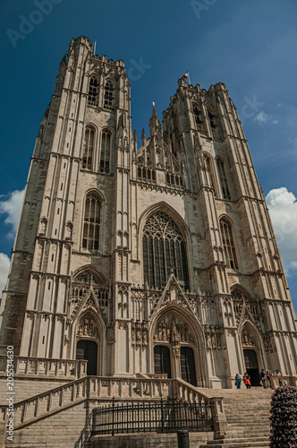 Gothic facade of St. Michael and St. Gudula’s Cathedral and blue sunny sky in Brussels. Vibrant and friendly, is the country’s capital and administrative center of the EU. Central Belgium.