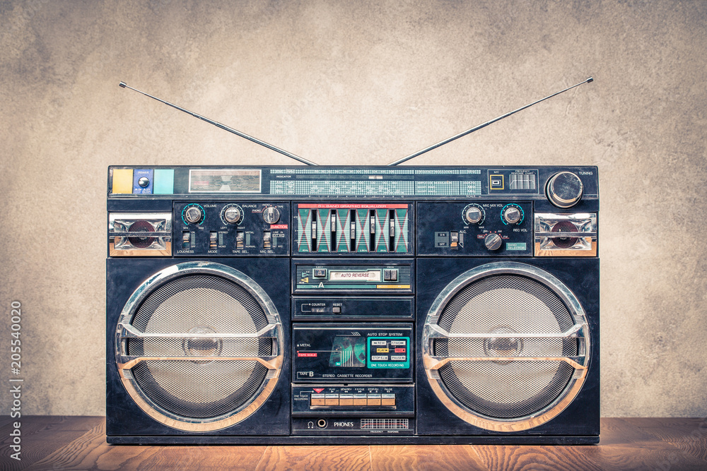 Retro design ghetto blaster stereo radio cassette tape recorders boombox  from circa 80s front concrete wall background. Vintage instagram old style  filtered photo Stock Photo | Adobe Stock
