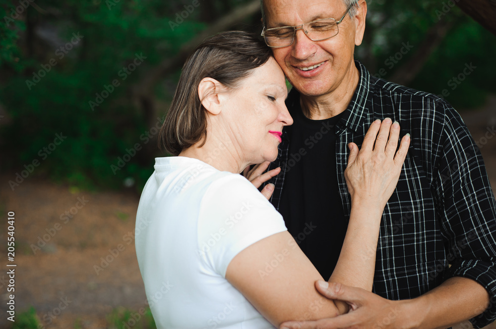 Fototapeta premium Senior couple strolling in the park