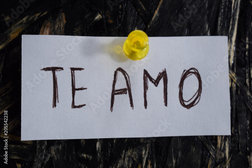 te amo  written in Spanish, means to i love you, on a white sheet of paper.