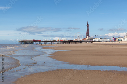Blackpool Tower and Central Pier as seen from the beach.