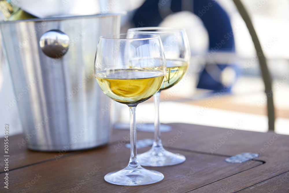 Pair of wineglasses against the yacht Pair of wineglasses against the yacht
