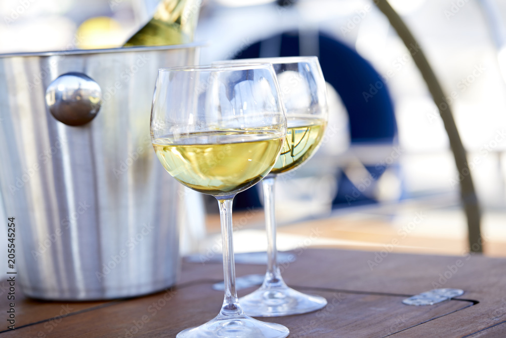 Pair of wineglasses against the yacht Pair of wineglasses against the yacht