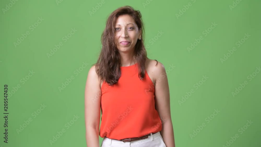 Beautiful businesswoman against green background Beautiful businesswoman against green background