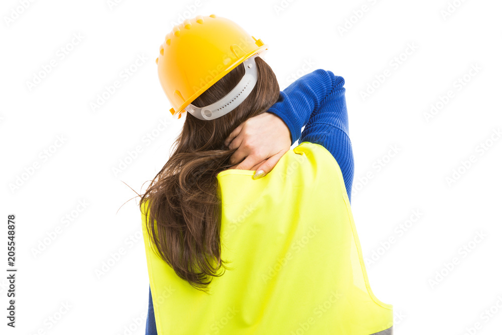 Woman architect massaging painful neck. Woman architect massaging painful neck.