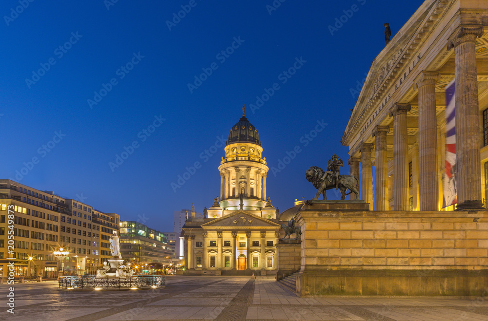 Berlin - The Deutscher Dom church and Gendarmenmarkt square and the Concert house at dusk.