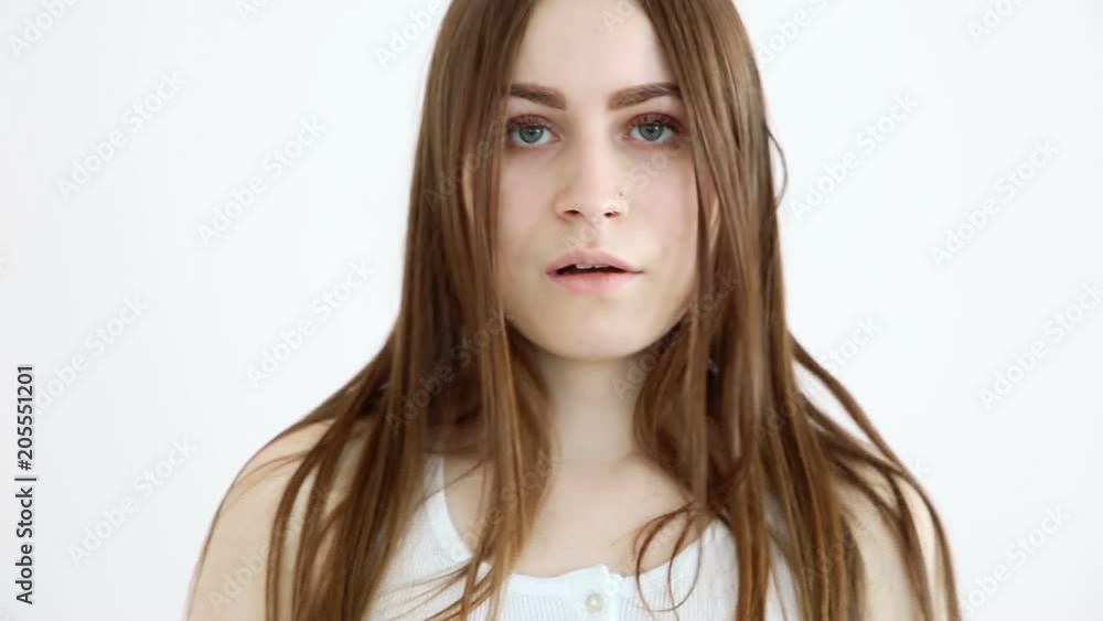 beautiful girl says no and closes the camera with her hand beautiful girl says no and closes the camera with her hand
