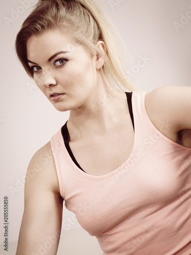 Woman in sportswear being serious