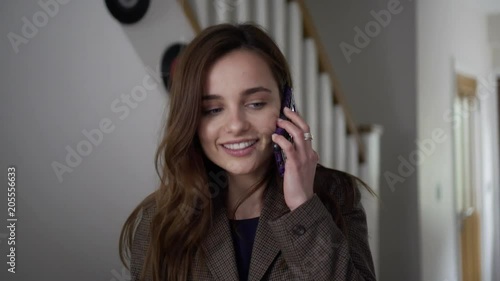Pretty Business lady talks on phones then hangs up. Handheld of attractive young millennial businesswoman talking on phone then hanging up