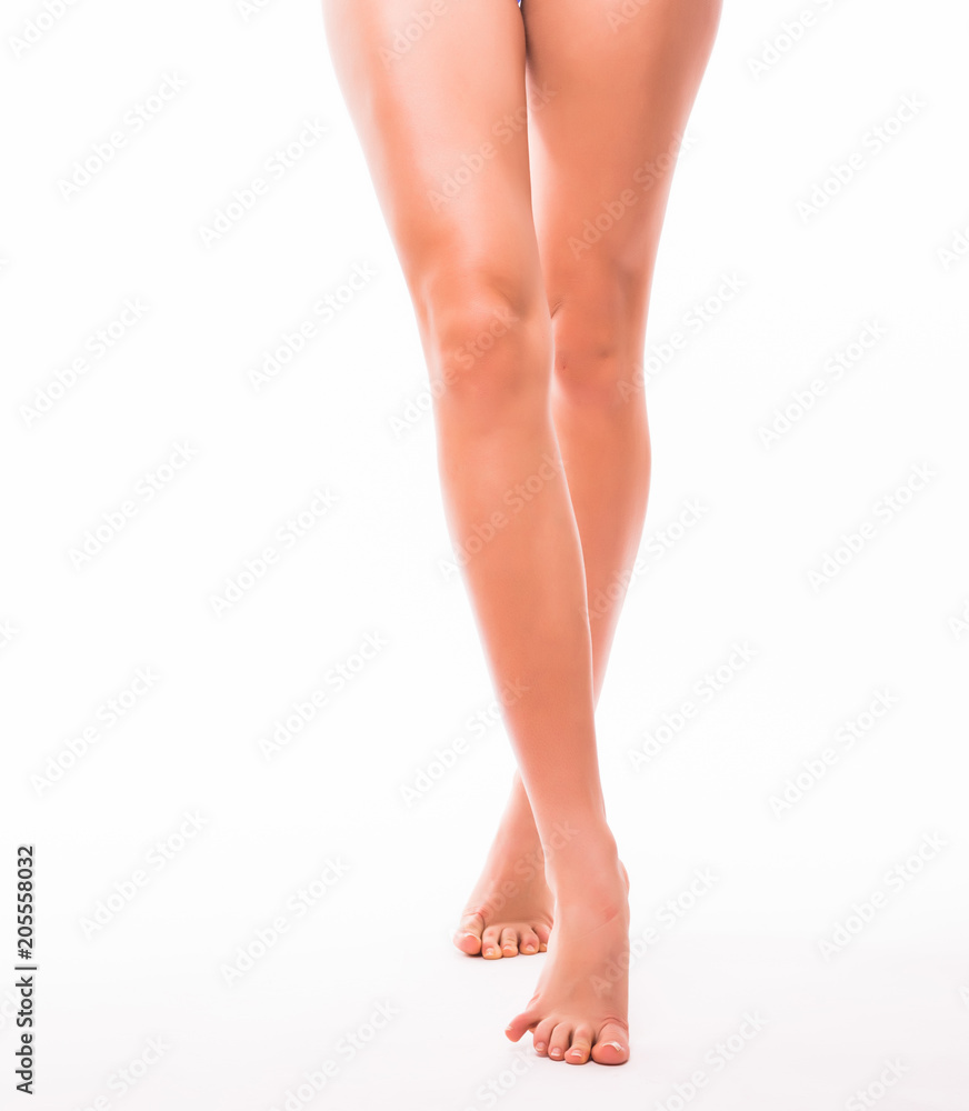 Perfect young female legs isolated on white background Perfect young female legs isolated on white background