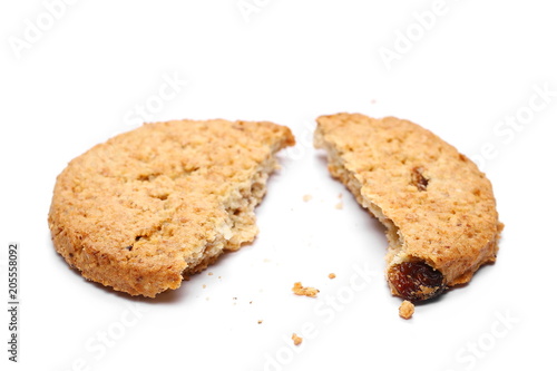 Round whole wheat biscuits with raisins isolated on white background