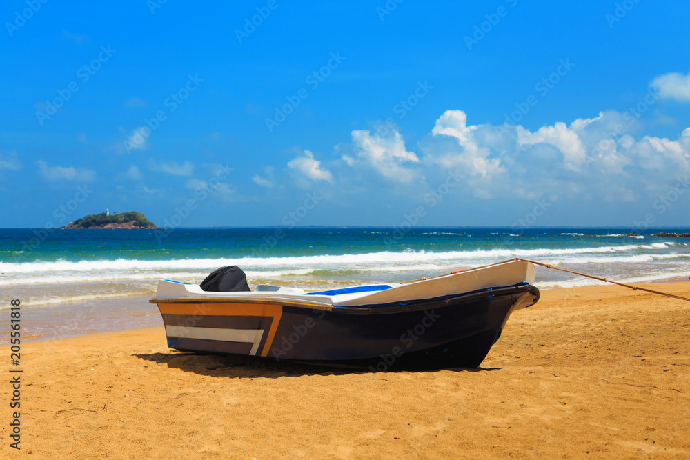 fishery, one fishing wooden boat on the tropical coast