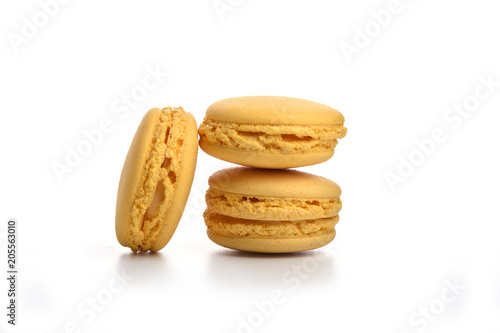 Yellow macaroons isolated on white