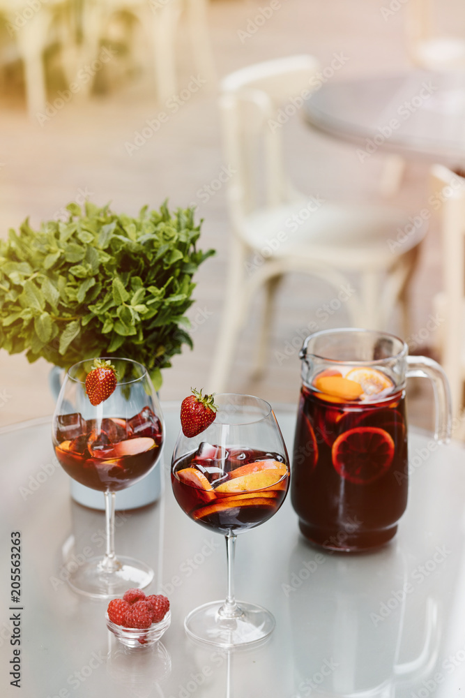 Top view of summer dinks, fruit cocktails on white wood table wi