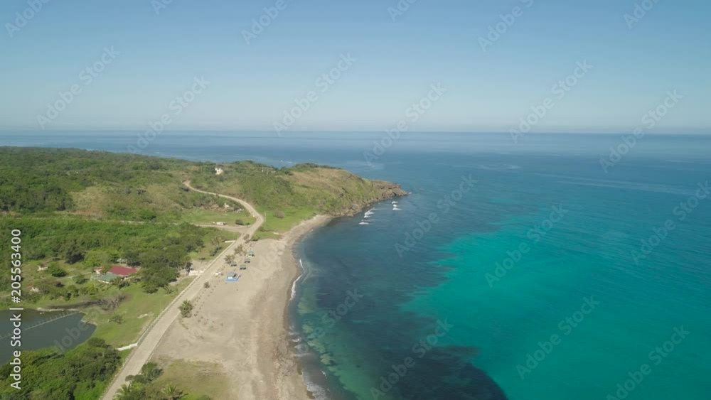 Aerial view of beautiful beach, lagoon and coral reefs. Philippines, Pagudpud. Ocean coastline with turquoise water. Tropical landscape in Asia. Aerial view of beautiful beach, lagoon and coral reefs. Philippines, Pagudpud. Ocean coastline with turquoise water. Tropical landscape in Asia.