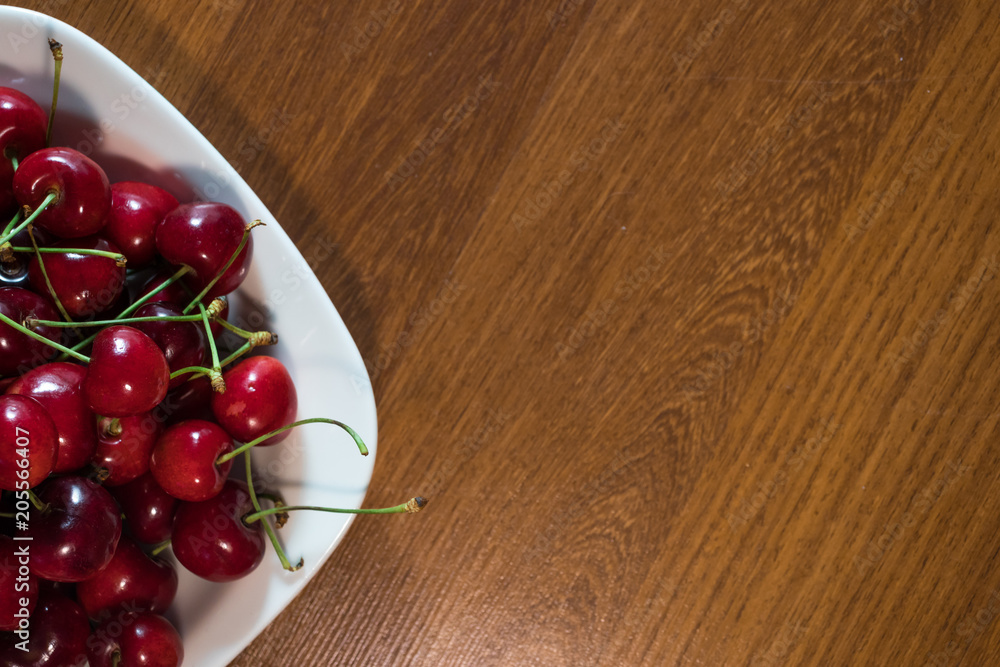 cherry in the plate on the table cherry in the plate on the table