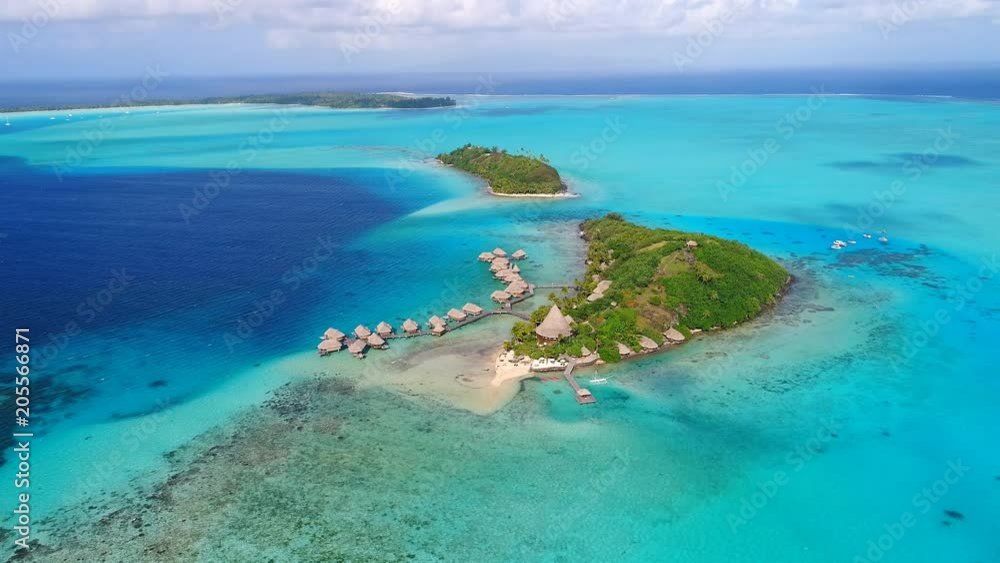 Aerial view of tropical paradise of Bora Bora island, turquoise crystal clear water of scenic lagoon, typical over water bungalows, Motu Piti 'U'u Uta (Sofitel) - South Pacific Ocean, French Polynesia Aerial view of tropical paradise of Bora Bora island, turquoise crystal clear water of scenic lagoon, typical over water bungalows, Motu Piti 'U'u Uta (Sofitel) - South Pacific Ocean, French Polynesia