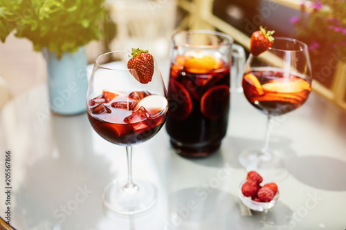 Top view of summer dinks, fruit cocktails on white wood table wi