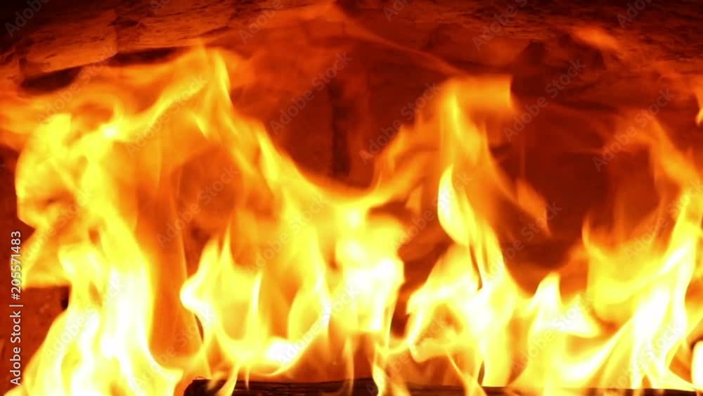 Firewood and fire flames in fireplace, bonfire close-up, 4K UHD.
Firewood and fire flames in fireplace, bonfire close-up, 4K UHD.