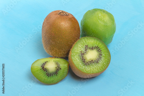 kiwi. sliced. half. fresh. fruit on old wood blue
