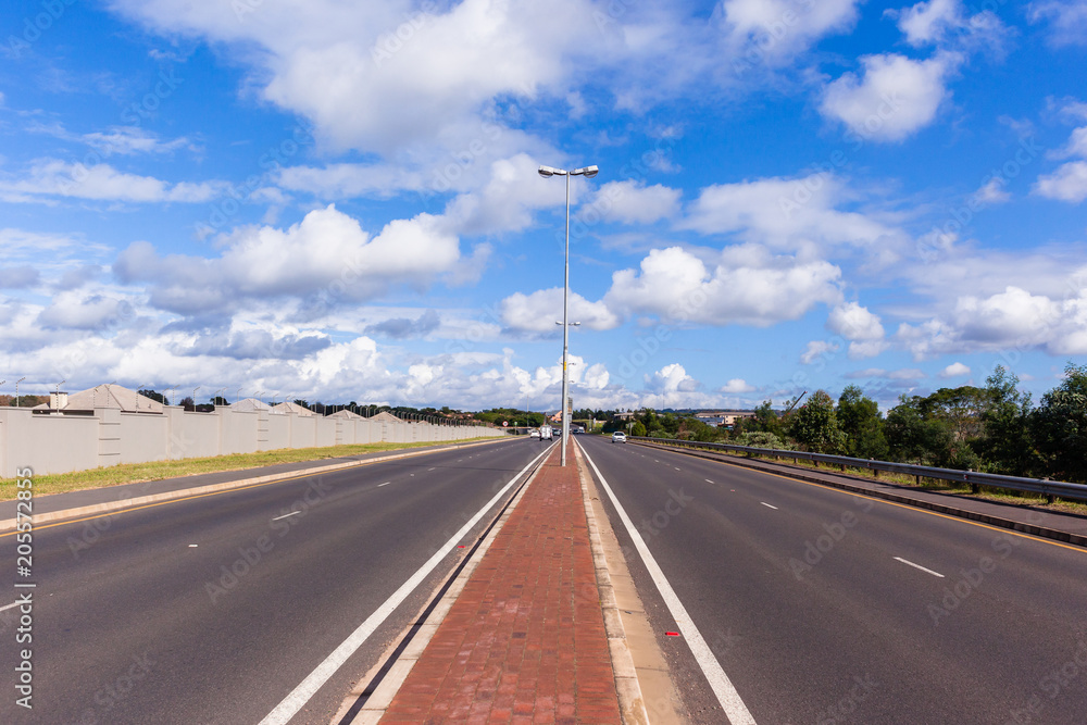 Fototapeta premium New Road Waterfall Hillcrest Countryside Gated Homes Landscape