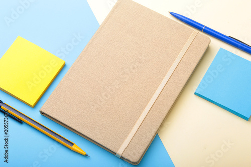 Notebook, pen, pencil and other supplies for business office. Copy space. Top view.