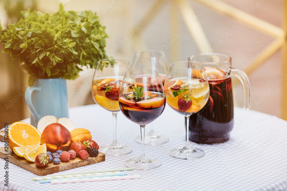 Top view of summer dinks, fruit cocktails on white wood table wi Top view of summer dinks, fruit cocktails on white wood table wi