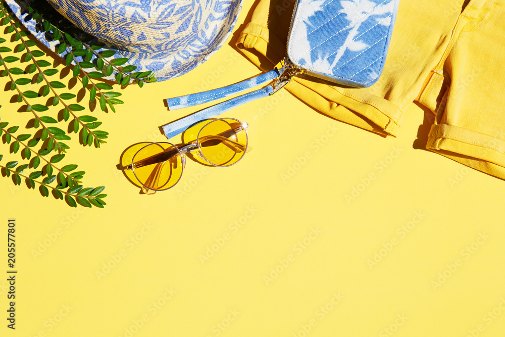Summer fashion clothing and accessories on yellow background, trendy  tropical fashion item flat lay Stock Photo | Adobe Stock