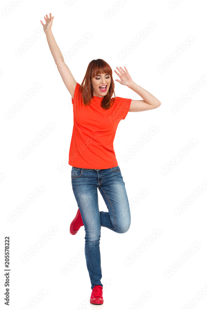 Happy Casual Young Woman Is Standing On One Leg And Shouting Happy Casual Young Woman Is Standing On One Leg And Shouting