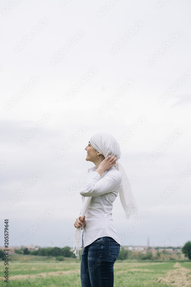 woman with white headscarf, has cancer woman with white headscarf, has cancer