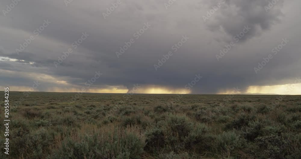 Dolly left rain falls over distant mountains Dolly left rain falls over distant mountains