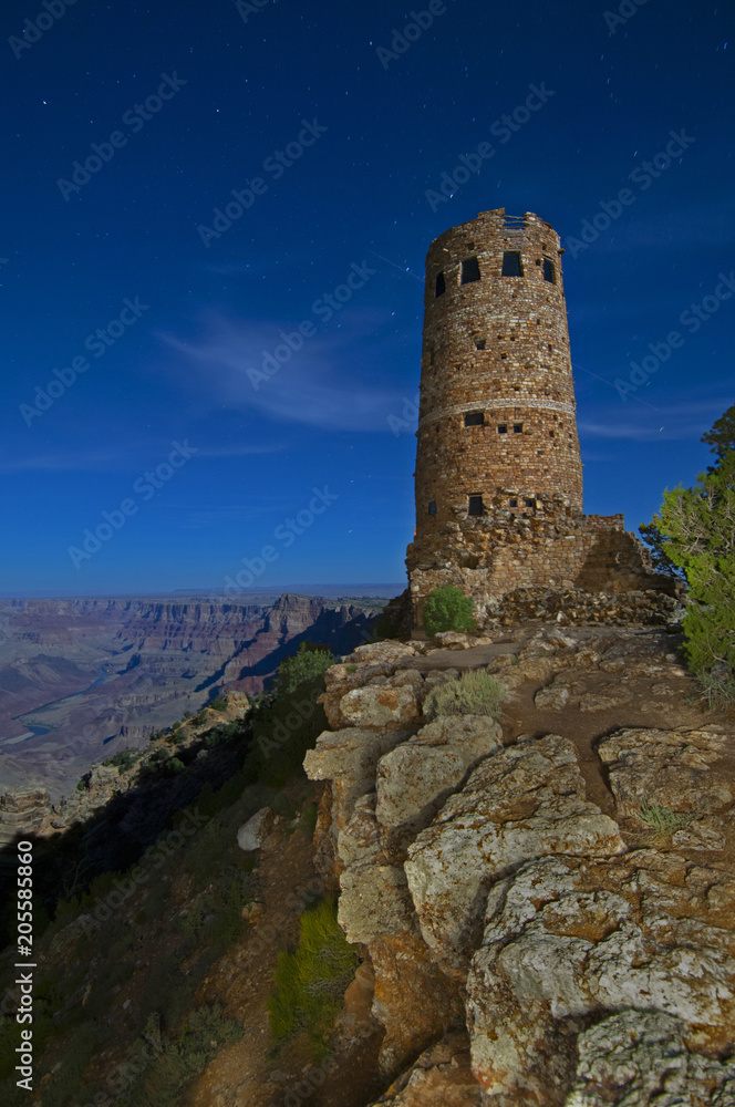 A 102-second exposure of the Watchtower in the Grand Canyon under a starry night sky.