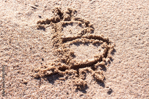 Bitcoin on sand. Mining. Digital currency. Cryptocurrency. Concept freelance, stock exchange.