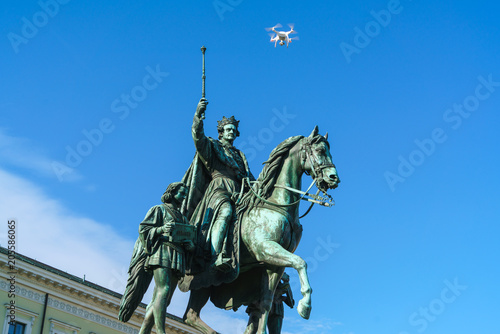 Equestrian statue of Ludwig I of Bavaria (1862) and flying drone quadrocopter, Munich, Germany