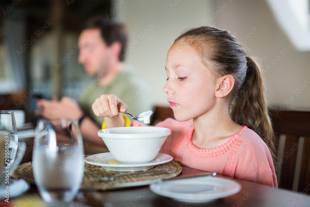 Little girl eating breakfast Little girl eating breakfast