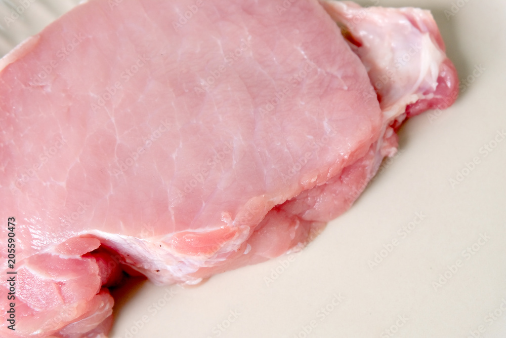 close up slice of raw pork ,soft focus close up slice of raw pork ,soft focus